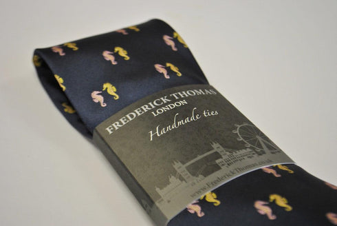 navy tie with seahorse design
